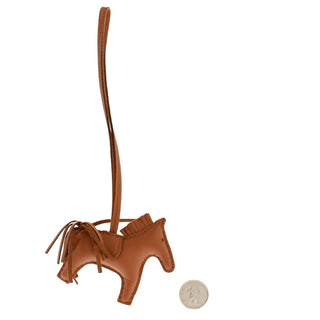 Hermès Rodeo Charm PM Gold side view