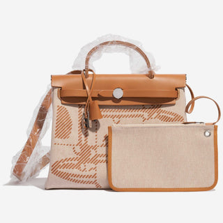 Hermès Herbag Zip Backpack 31 Gold / Ecru front view