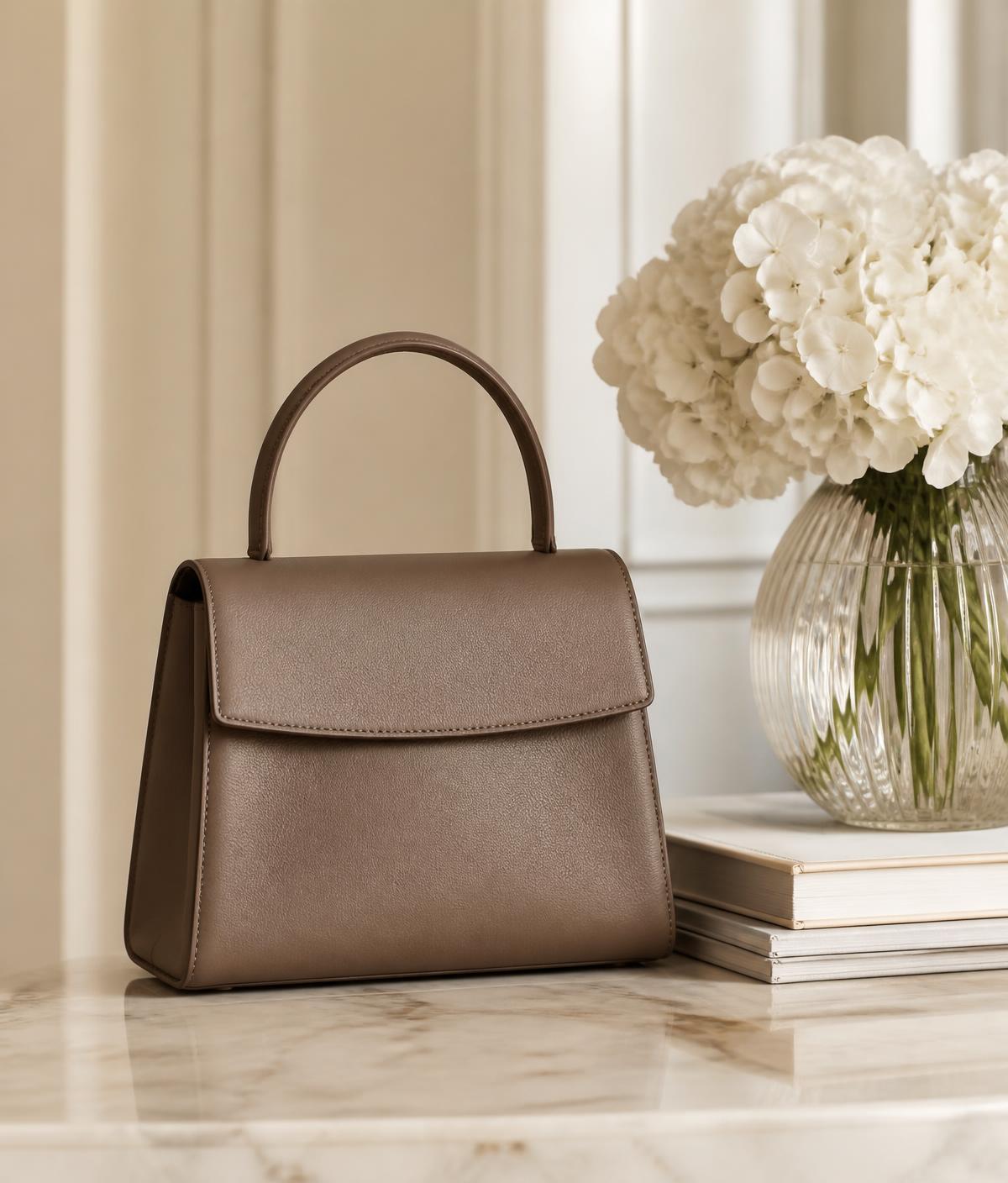 Authenticated luxury handbag styled in a warm neutral interior